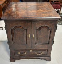 A 19TH CENTURY OAK CABINET, Two doors over a single drawer, with shelves.