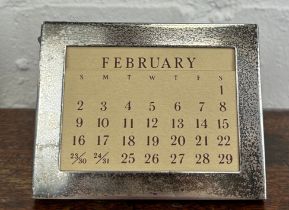 A TIFFANY AND CO SILVER PERPETUAL CALENDAR, 9.5cm x 7cm