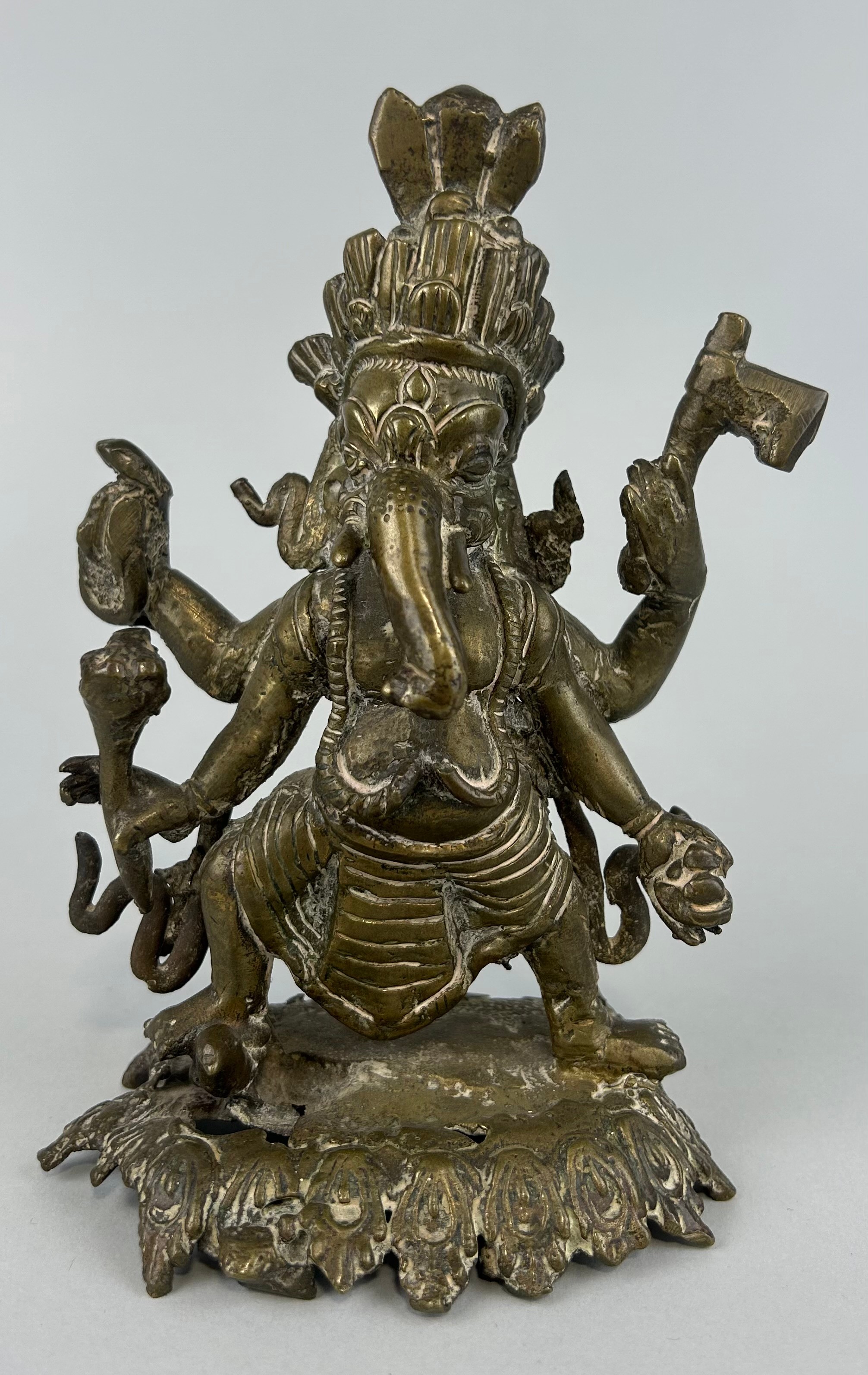 AN INDIAN BRONZE FIGURE OF GANESH PROBABLY 17TH OR 18TH CENTURY, 18cm x 11cm
