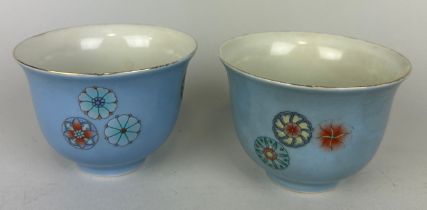 A PAIR OF CHINESE LILAC GROUND CUPS DECORATED WITH FLOWERS, Kangxi six character marks to verso, but