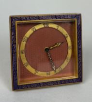 AN ART DECO 1920'S TRAVEL CLOCK WITH GREEK KEY BORDER AND ENGINE TURNED MAUVE DIAL, In running