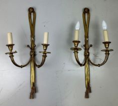 A PAIR OF REGENCY STYLE GILT BRASS WALL SCONCES (2), 63cm x 25cm each.