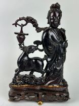 A CHINESE AMBER STATUE DEPICTING HSI WANG MU, Accompanied by a letter, written in French along