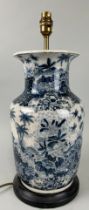 A CHINESE BLUE AND WHITE CERAMIC VASE ADAPTED FOR A LAMP, 37cm H