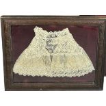 A FRAGMENT OF LACE, Mounted in a frame and glazed. 54cm x 44cm