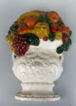 A CERAMIC GLAZED PAINTED MODEL OF AN URN WITH FRUIT, 45cm x 35cm