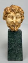 A ROMAN STYLE BUST OF AN EMPEROR ON GREEN MARBLE STAND, Bust 14cm x 11cm Mounted (loosely) on