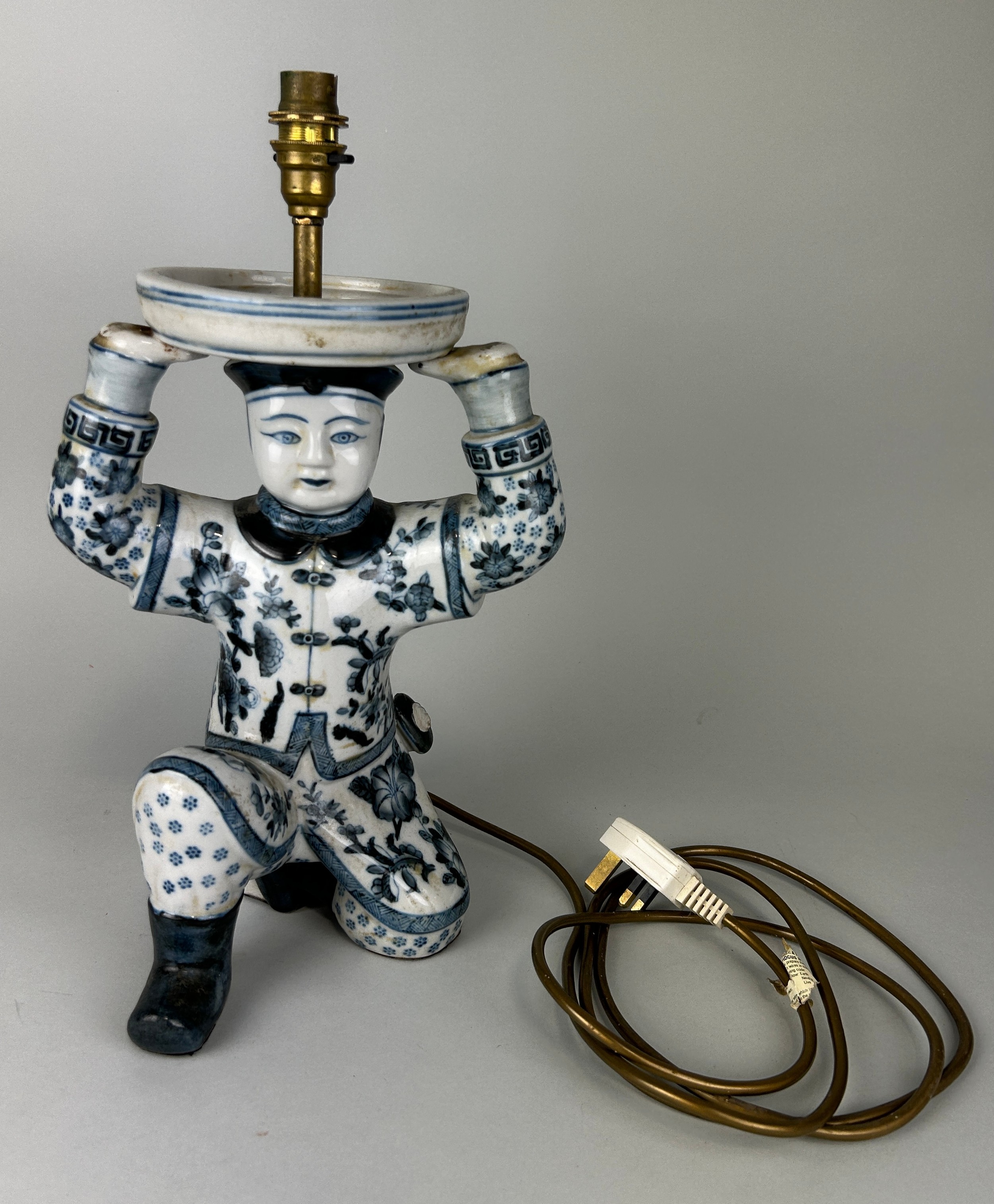 A CHINESE BLUE AND WHITE TABLE LAMP IN THE FORM OF A BOY, 32cm H
