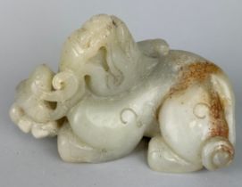A CHINESE JADE FIGURE OF A LION IN THE ARCHAIC STYLE, 17cm x 10cm