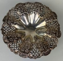 A SILVER DISH MARKED FOR WILLIAM DEVENPORT, Pierced design with repousse flowers, on four legs.