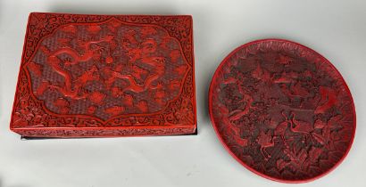 A CHINESE RED LACQUERED CINNABAR BOX ALONG WITH A SIMILAR CIRCULAR PLATE (2), Box 39cm x 29cm