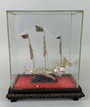 A CHINESE SILVER JUNK SHIP IN PERSPEX CASE, 21cm x 17cm