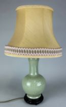 A 20TH CENTURY CHINESE CELADON VASE ADAPTED FOR A LAMP, 33cm H With shade 54cm H