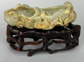 A CHINESE JADE MOUNTED ON ROSEWOOD STAND, Jade measures 12cm x 5cm