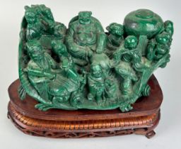 A CHINESE MALACHITE SCULPTURE DEPICTING A BUDDHA WITH FIGURES PLAYING MUSICAL INSTRUMENTS, 30cm x