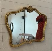 A wooden gold painted hall mirror in the rococo style 100cm x 76cm