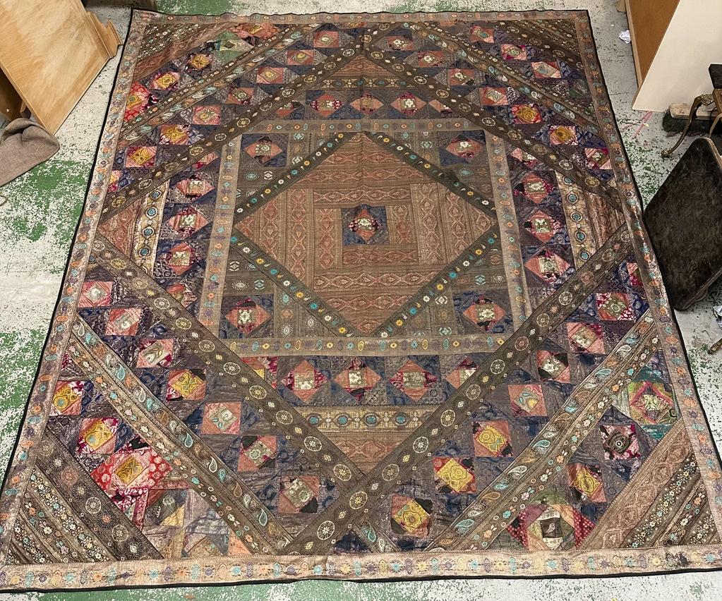 A Persian embroidered textile in cottons and silks 265cm x 224cm