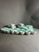 A part two tone dinner service by Poole pottery