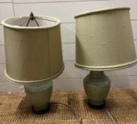 A pair of green table lamps