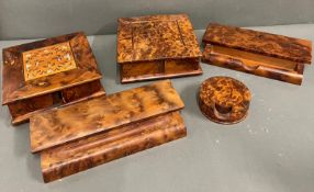 Five items of burr walnut desk accessories including pen holders etc