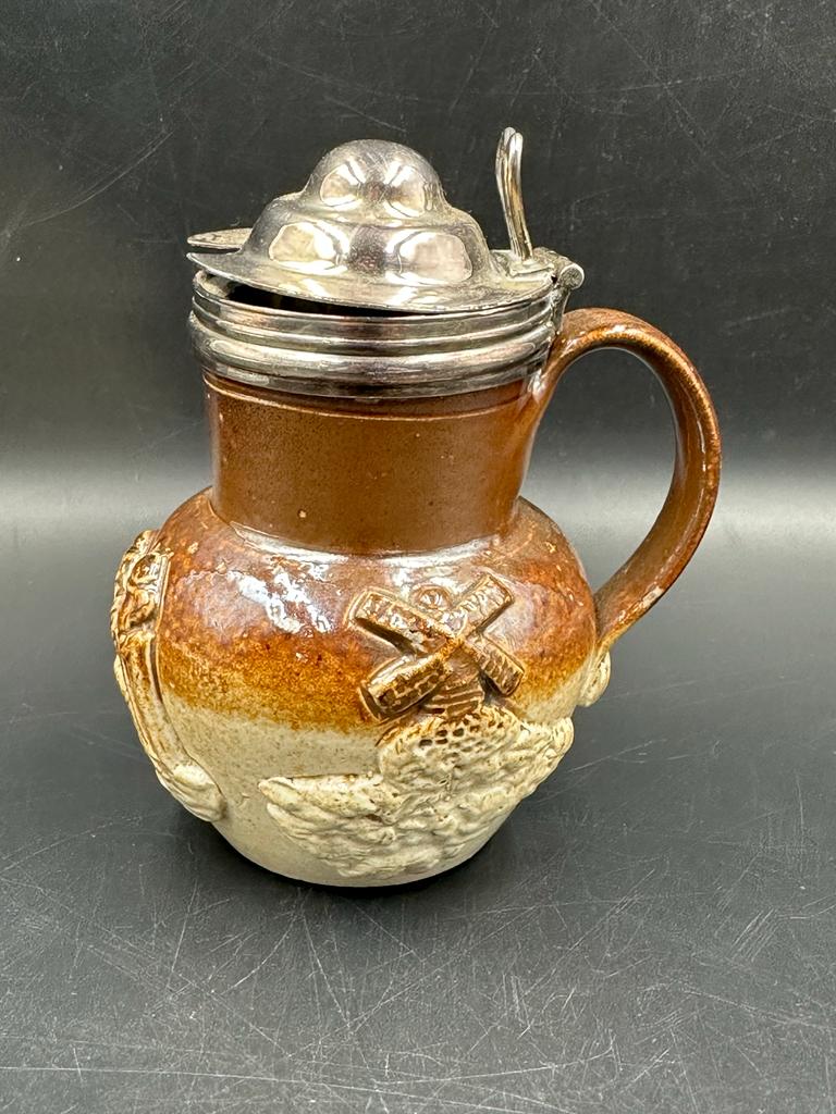 A 19th Century Doulton salt glazed mustard pot with white metal collar and lid