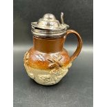 A 19th Century Doulton salt glazed mustard pot with white metal collar and lid
