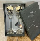 A pair of glass candle sticks, boxed