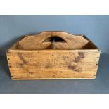 A vintage oak carrying tray comprising of four compartments and a handle