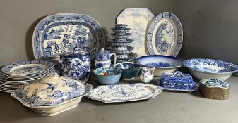 A quantity of blue and white China to include serving dishes, plates and bowls