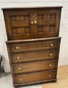 A Mid Century oak drinks cabinet by Priory consisting of four drawers with cupboard over (H123cm