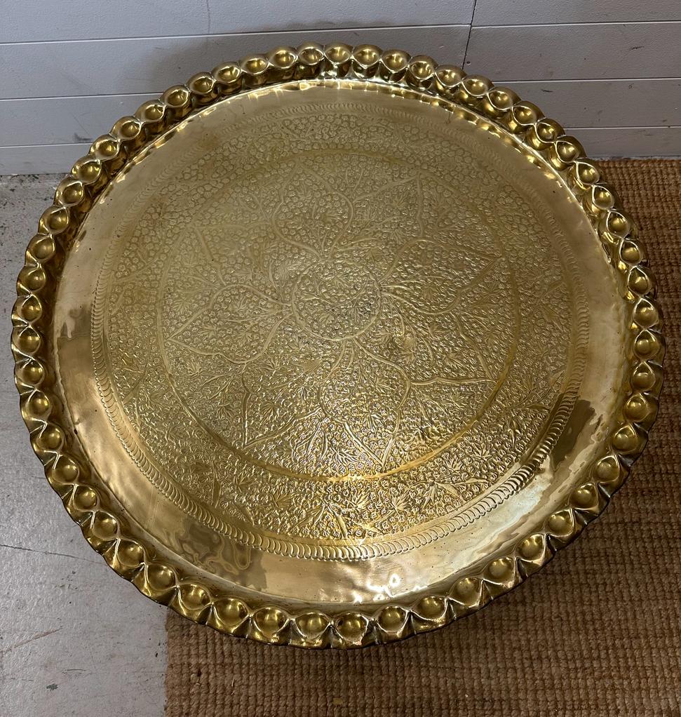 A brass engraved Middle Eastern tea table on brass engraved stand. Diameter 82 height 38 - Image 2 of 4