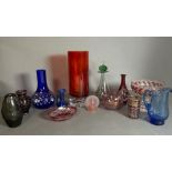 A selection of coloured glass to include vases, jugs and dishes