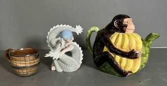 A selection of three ceramics to include a monkey teapot, Lambeth Doulton milk jug and a Yoshomik