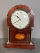 A French mahogany inlaid enamel face mantel clock