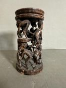 A carved African candle stick