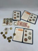 A selection of collectable coins: 1953 collectors pack, a collection of three pence pieces, a 10