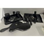 An ebony dressing table set