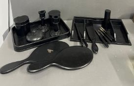 An ebony dressing table set