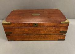 A mahogany and brass writing slope with green leather interior