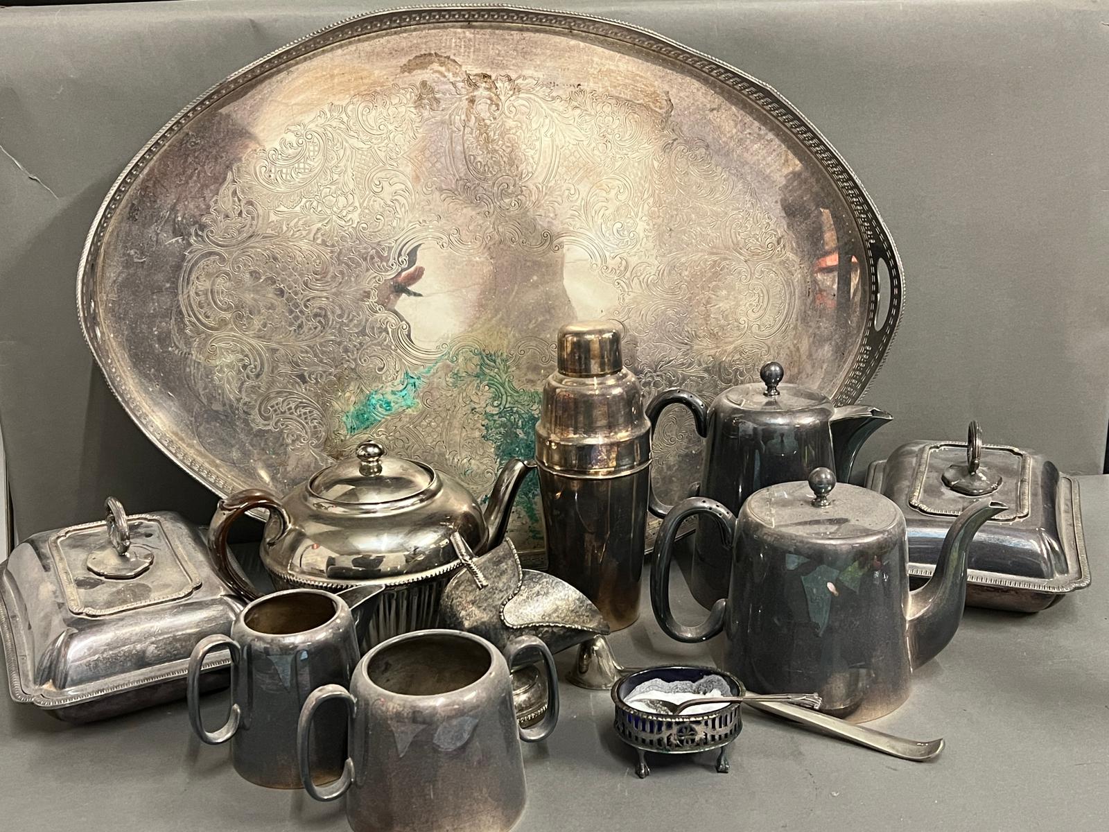A selection of white metal items including teapots, trays etc