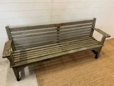 A wooden slatted garden bench