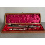 A boxed horn carving set in cast steel