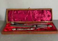 A boxed horn carving set in cast steel