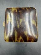 A vintage tortoise cigarette case