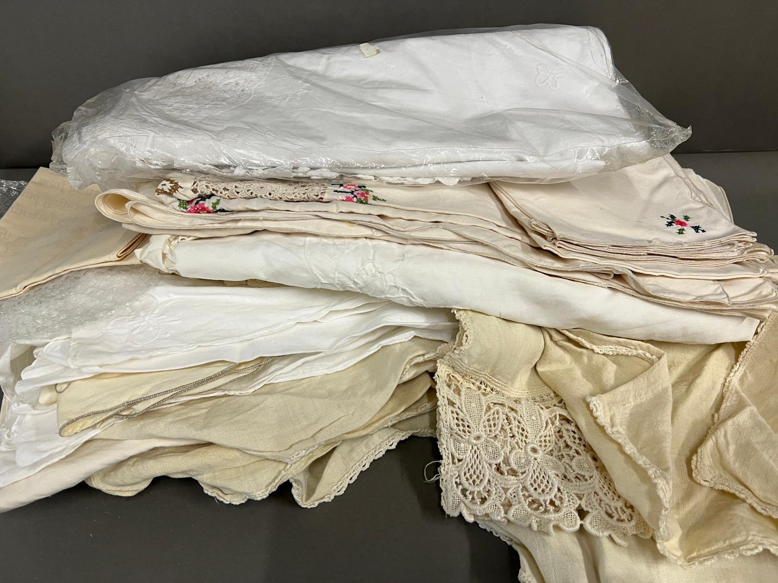 A collection of linen various sizes and ages