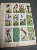 An album of vintage cigarette cards with players, wills, various ages and themes