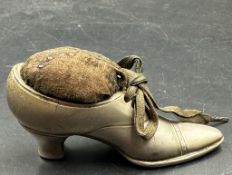 A Victorian shoe pin cushion