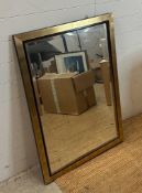 A contemporary wooden gold painted two tone hall mirror (72cm x 103cm)