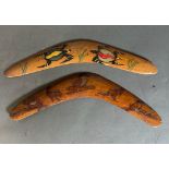 Two painted and carved decorative boomerangs