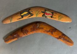 Two painted and carved decorative boomerangs